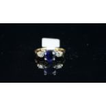 Heart shaped sapphire and diamond three stone ring, mounted in yellow and white metal stamped '