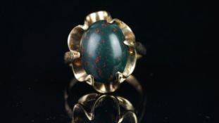 Single stone oval bloodstone ring, mounted in hallmarked 9ct yellow gold, finger size O, approximate