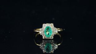 Emerald and diamond cluster ring, oval cut Emerald, 7.1 x 5.2mm, brilliant cut diamonds,