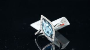 NEW OLD STOCK, Blue topaz and diamond ring, marquise cut topaz, diamond set surround, estimated