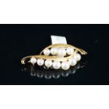 Pearl brooch, mounted in yellow metal stamped 'K14', approximate weight 7.4 grams.