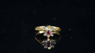 Ruby and diamond cluster ring, mounted in hallmarked 18ct yellow gold, finger size K, approximate