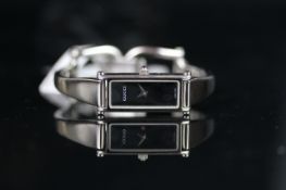 LADIES' GUCCI RECTANGULAR, REF. 1500L, QUARTZ WRISTWATCH, rectangular black dial with sword hands,