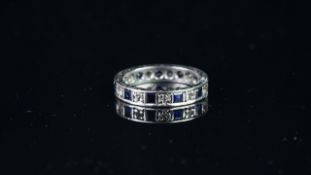 Blue and white stone full eternity ring, mounted in hallmarked 9ct white gold, finger size J,