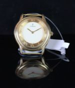 GENTLEMEN'S 18CT CORUM, curved case Corum, circular two tone gold dial, In 18ct