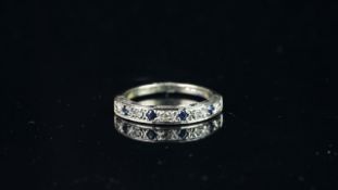 Blue and white stone half eternity ring, mounted in hallmarked 9ct yellow & white gold, finger