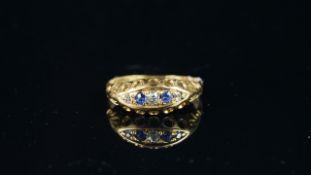 Sapphire and diamond boat shaped ring, mounted in yellow metal (rubbed hallmark), finger size P,