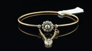 Diamond cluster bangle, old cut diamond daisy cluster, on a rope design bangle in unmarked yellow