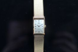 RARE LADIES' 18K GOLD OMEGA LADYMATIC, REF. 551.015, ORIGINAL 18K BRACELET, CAL 661, CIRCA. 1963,