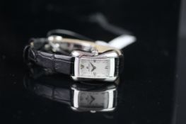 LADIES' MAURICE LACROIX WRISTWATCH, rectangular grey dial with roman numerals and set with gems,