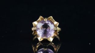 Single stone ring, round purple stone, mounted in hallmarked 9ct yellow gold, finger size N,