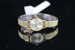 LADIES' OMEGA LADYMATIC, GOLD PLATED WATCH, 750 STAMPED GOLD SMALL CHARM ATTACHED, VINTAGE AUTOMATIC