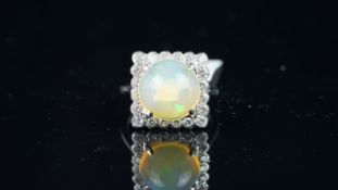 Opal and diamond square cluster ring, mounted in white metal with French marks for 18ct gold,