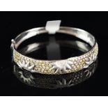 Diamond set bangle, wide diamond set panel with sun detail, set with yellow and white round