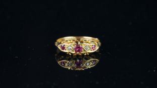 Antique Ruby and Diamond five stone ring, three rubies with two small old cut diamonds, central 3.