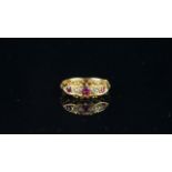 Antique Ruby and Diamond five stone ring, three rubies with two small old cut diamonds, central 3.