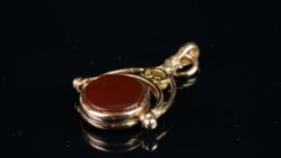 Two stone swivel fob, mounted in hallmarked 9ct yellow gold, approximate weight 3.1 grams.