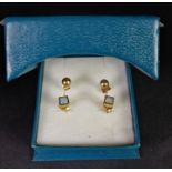 Two pairs of 9ct yellow gold studs earrings, gross weight approximately 1.20 grams.