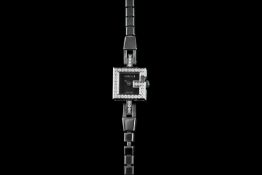 LADIES GUCCI DRESS WATCH, square black dial, 14mm stone set case, stainless steel, case and