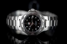 GENTLEMEN'S TAG HEUER PROFESSIONAL 200M REFERENCE WL1110, black circular dial, luminous dot hour