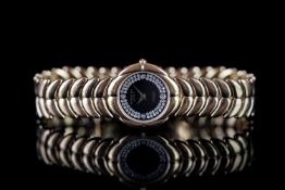 LADIES RAYMOND WEIL ADJAGIO, circular black dial, stone set, gold plated case and bracelet,