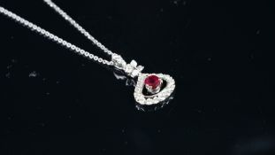 NEW OLD STOCK, Ruby and diamond pendant, circular ruby estimated weight 0.42ct, diamond mount,