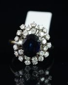 Sapphire and diamond dress ring, central oval cut sapphire measuring approximately 9.29 x 7.63 x 3.
