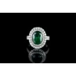 Emerald and diamond ring, 1 oval cut emerald estimated 3.70ct, 4 claw set, surrounded by 72 round