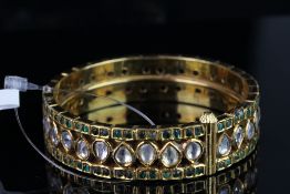 Polki diamond and emerald? bangle, 30 diamonds set to the centre, total of 120 emeralds set either