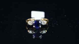 Heart shaped sapphire and diamond three stone ring, mounted in yellow and white metal stamped '