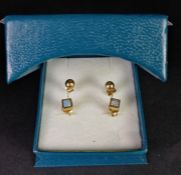 Two pairs of 9ct yellow gold studs earrings, gross weight approximately 1.20 grams.