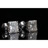 9.80ct Diamond stud earrings, a pair of modified square cut diamonds, weighing an estimated 9.