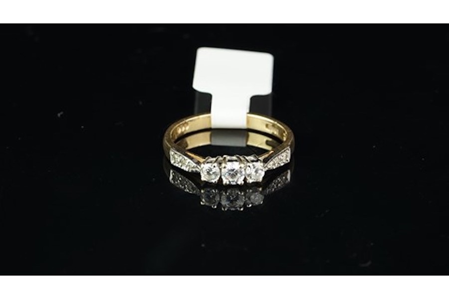 A cubic zirconia ring, set in yellow metal, ring size L, approximate weight 2.1 grams.