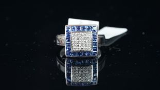 NEW OLD STOCK, Sapphire and Diamond ring, central square of diamonds, outer border of tension set