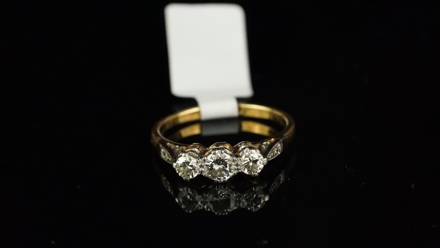 Three stone diamond ring, three round brilliant cut diamonds, weighing an estimated total of 0.55ct,