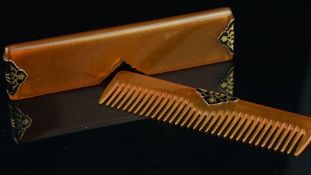Pressed horn comb with case, with gold and black enamel detail