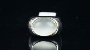 Single stone moonstone ring, mounted in white metal stamped 750, set with oval shaped cabochon