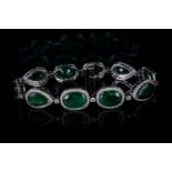 Emerald and diamond tennis bracelet, 6 oval cut Zambian emeralds and 4 pear cut Zambian emeralds