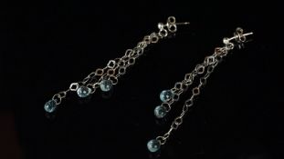 Topaz drop earrings, three chain drops set from each stud, each terminated by a briolette cut blue