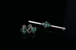 Pair of emerald and diamond earrings with matching brooch, total of 2 diamonds set to the centre
