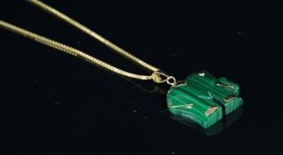 A malachite elephant pendant, with yellow metal detail, on a yellow metal box link chain stamped