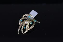 Pearl and turquoise stone floral brooch, mounted in yellow metal stamped '333', with pin and