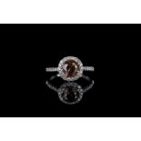 Champagne diamond cluster ring, set with 1 round brilliant cut champagne diamond estimated 1.64ct,