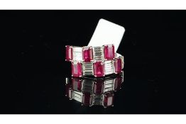 Ruby and diamond cocktail ring, six rectangular cut rubies set with baguette cut diamonds in a cross