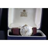 GENTLEMENS GARRARD 9CT GOLD AUTOMATIC WRISTWATCH W/ BOX, circular silver dial with arabic numerals