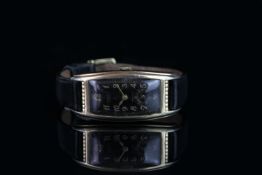 LADIES GRUEN CURVEX,oblong black dial with gold hands, gold arabic numbers,non date,38 X 20 mm