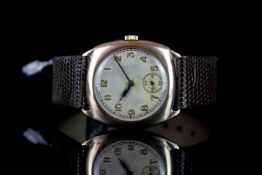 GENTLEMEN'S VINTAGE DRESS WATCH,cushion,silver dial with black hands, non date,28mm gold case