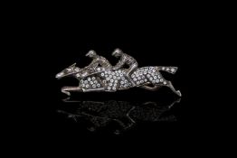 Double horse jockey brooch, diamond set, in yellow and white silver gilt, 5.5cm long,