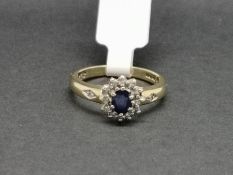 Sapphire and diamond cluster ring, oval cut sapphire surrounded by single cut diamonds, in 9ct