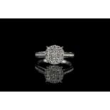 Diamond cluster ring, 9 princess cut diamonds to the centre, surrounded by 16 round brilliant cut